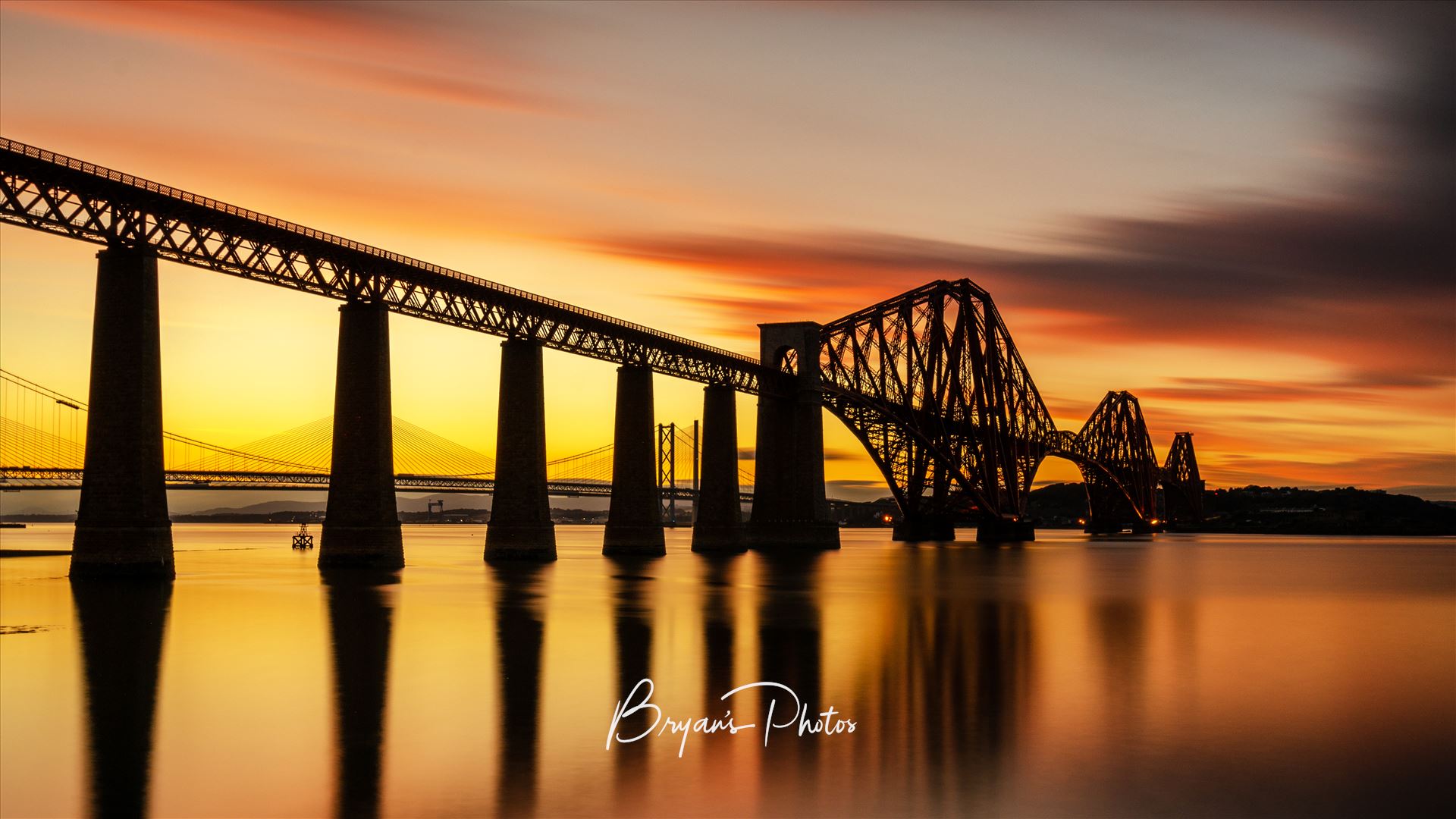 Rail Bridge Sunset Panorama - A panoramic photograph of the Forth Rail Bridge taken at sunset from South Queensferry. by Bryans Photos