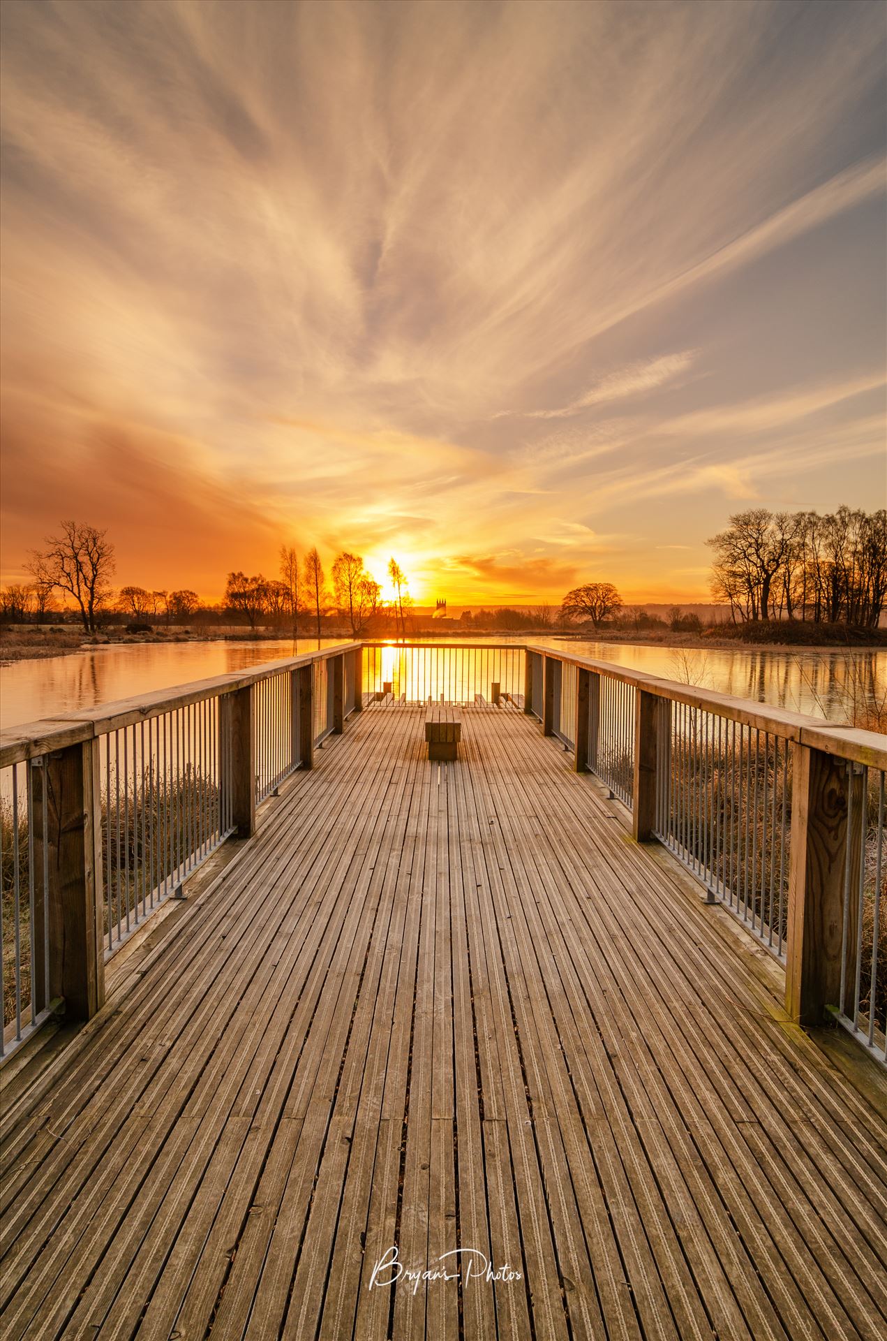 Sunrise at Larbert Loch - A colour photograph of a winter sunrise taken at Larbert Loch in the grounds of Forth Valley Royal Hospital. by Bryans Photos