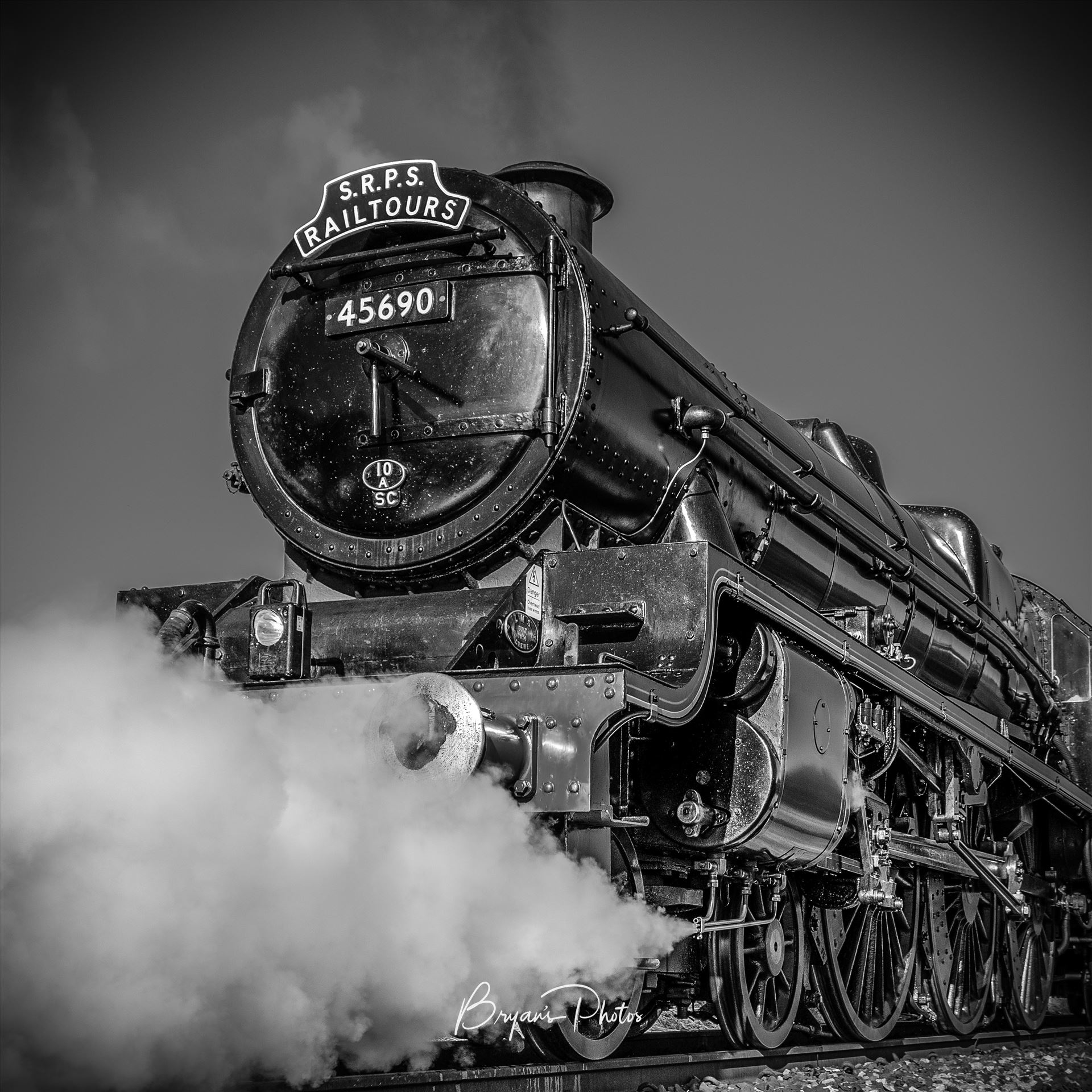 Leander - A black and white photograph of the LMS Jubilee Class 45690 Leander Steam Train taken as it runs on the Forth Circle. by Bryans Photos