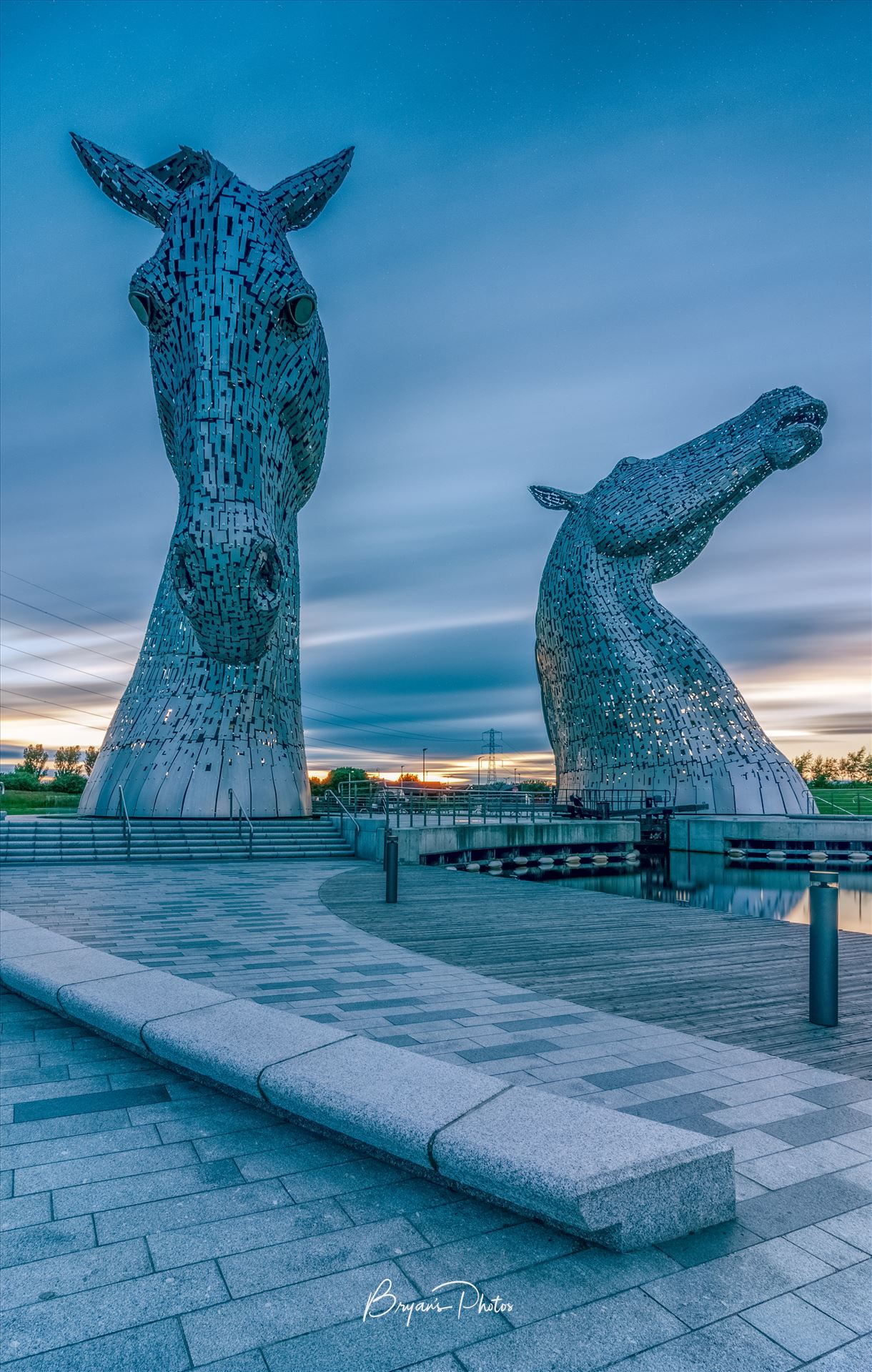 Evening at the Kelpies - A long exposure photograph of the Kelpies taken just before sunset. by Bryans Photos