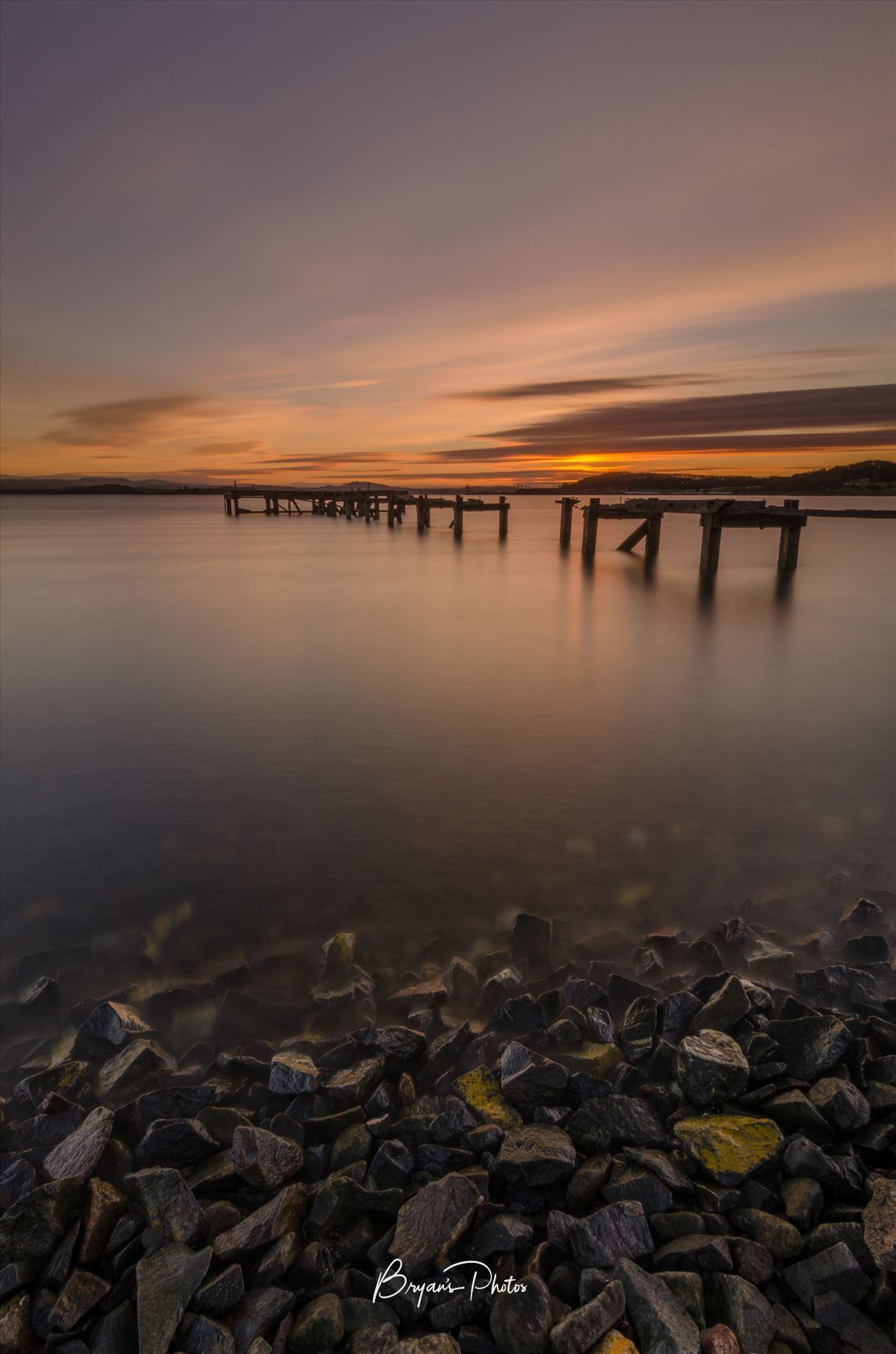 Aberdout at Sunset - A photograph of the Abandoned pier at Aberdour on the Fife coast taken as the sun sets. by Bryans Photos