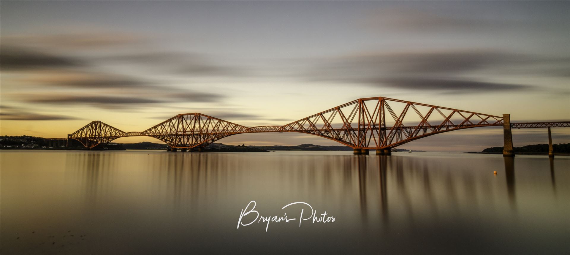 The Bridge at Sunset Panorama - A panoramic long exposure photograph of the Forth Rail Bridge taken at sunset from South Queensferry. by Bryans Photos