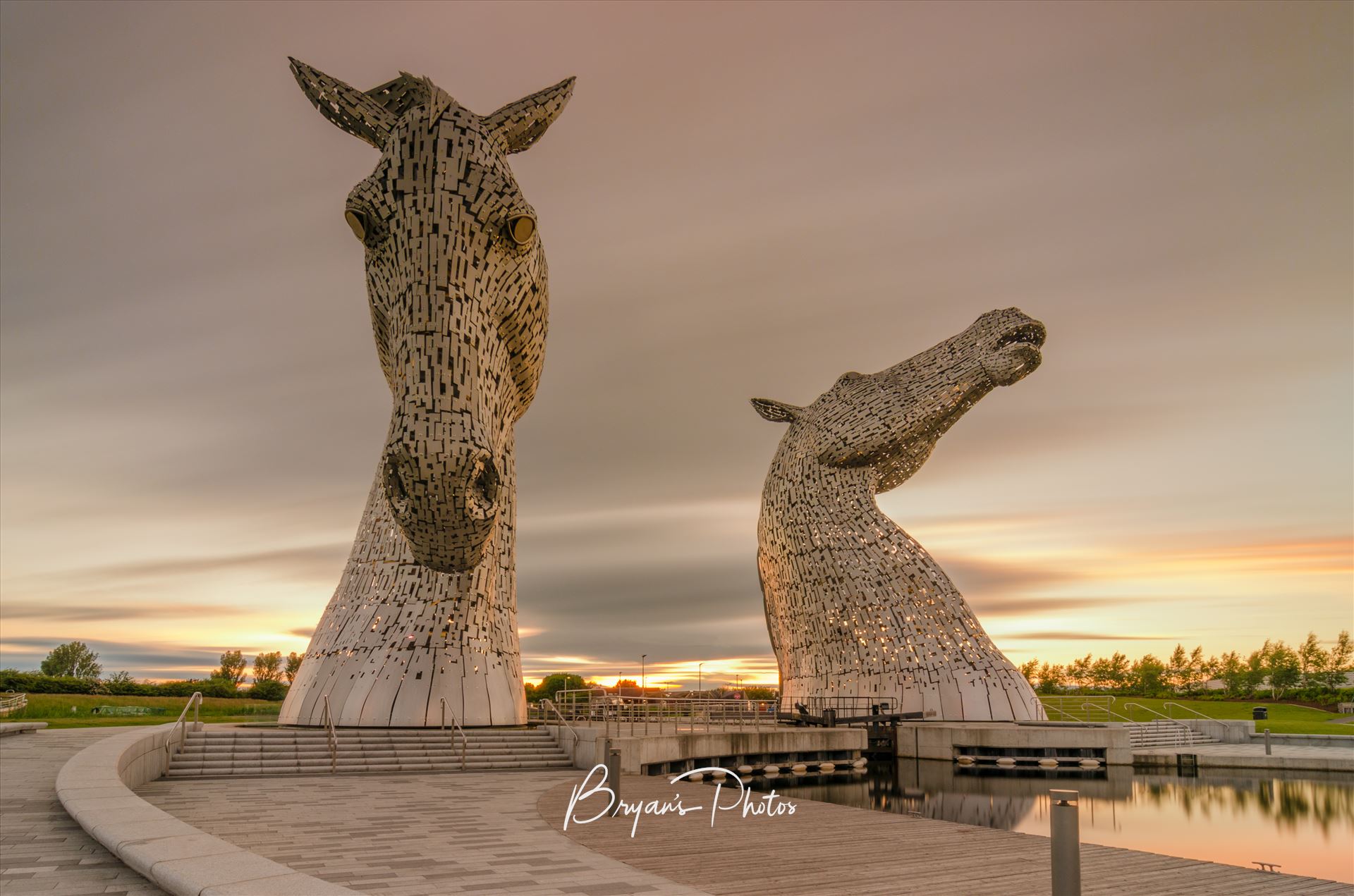 The Kelpies - A long exposure Photograph of the Kelpies taken as the sunsets. by Bryans Photos