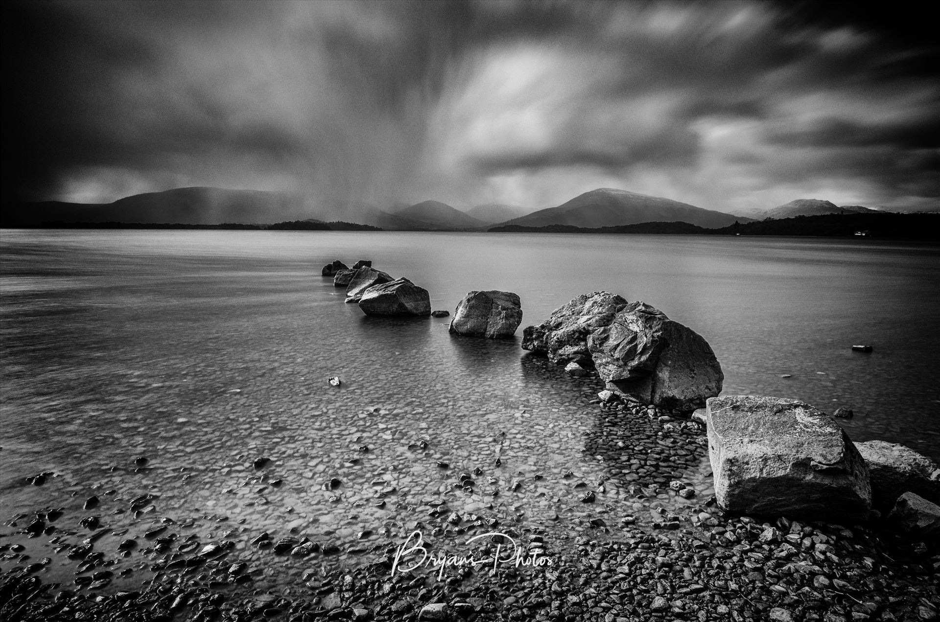 The Loch - A black and white long exposure photograph of Loch Lomond taken from Milarrochy Bay. by Bryans Photos