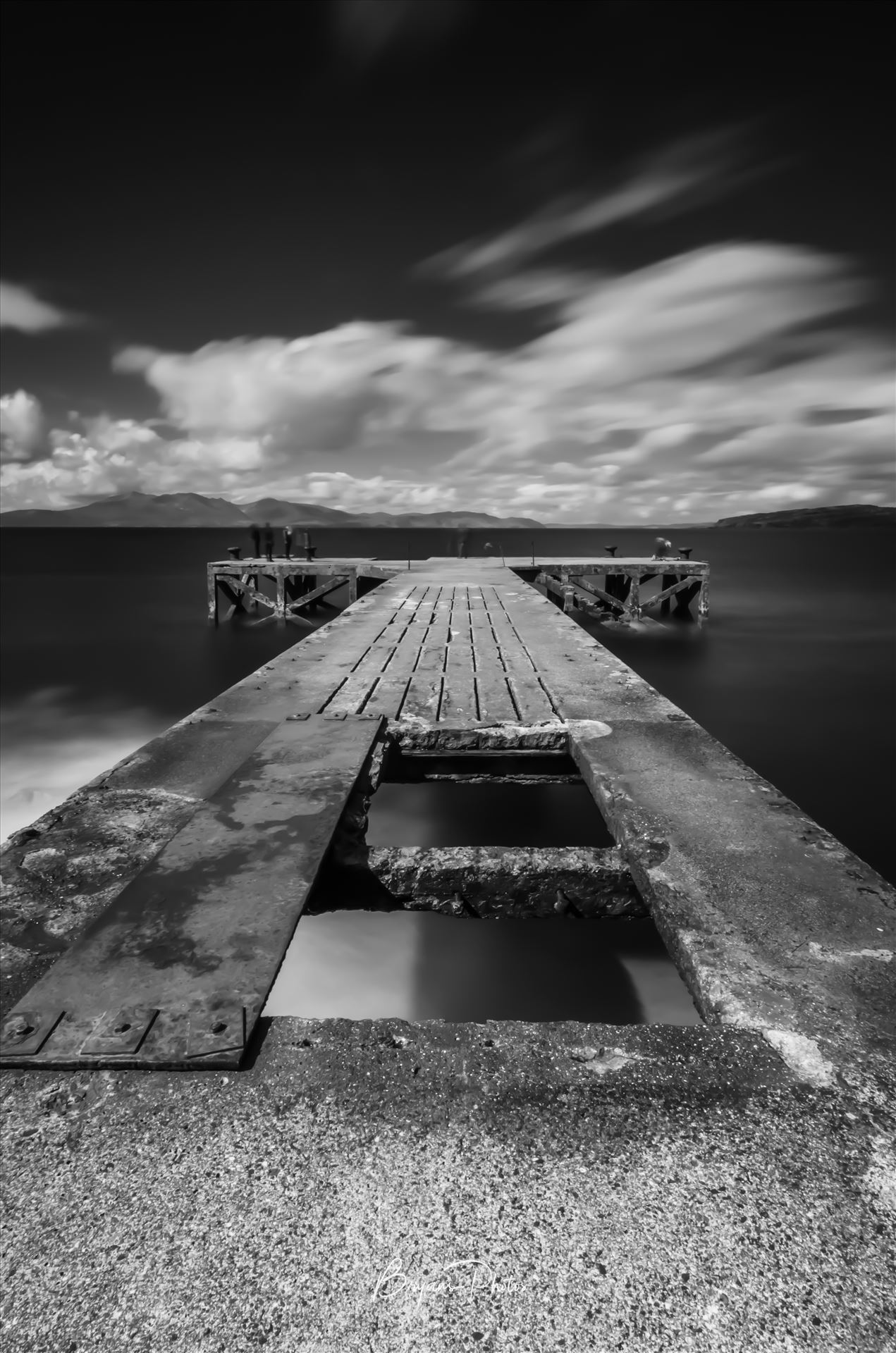 Portencross Pier - A photograph of the pier at Portenross looking over towards the Isle of Arran. by Bryans Photos