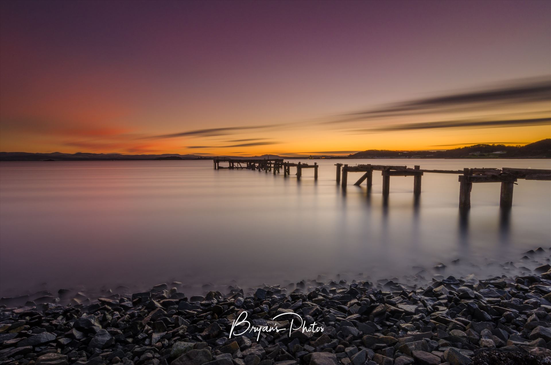 Sunset at Aberdour - A photograph of the Abandoned pier at Aberdour on the Fife coast taken as the sun sets. by Bryans Photos