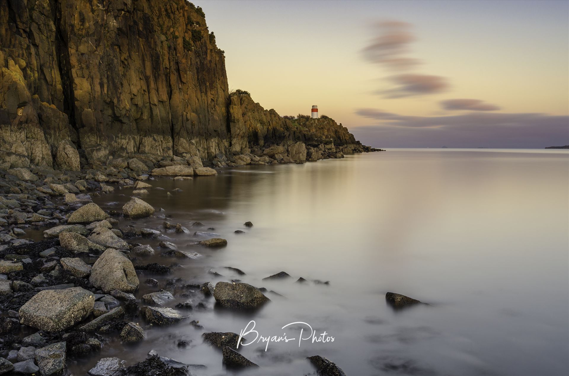 Hawkcraig - A colour long exposure photograph taken at sunset of Hawkcraig point Aberdour. by Bryans Photos