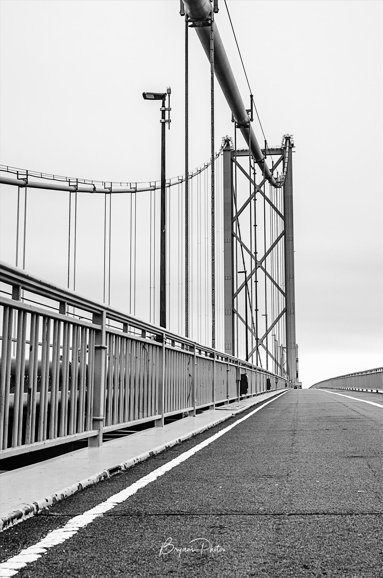 Forth Road Bridge - A black and white photograph of the Forth Road Bridge taken from the walkway. by Bryans Photos