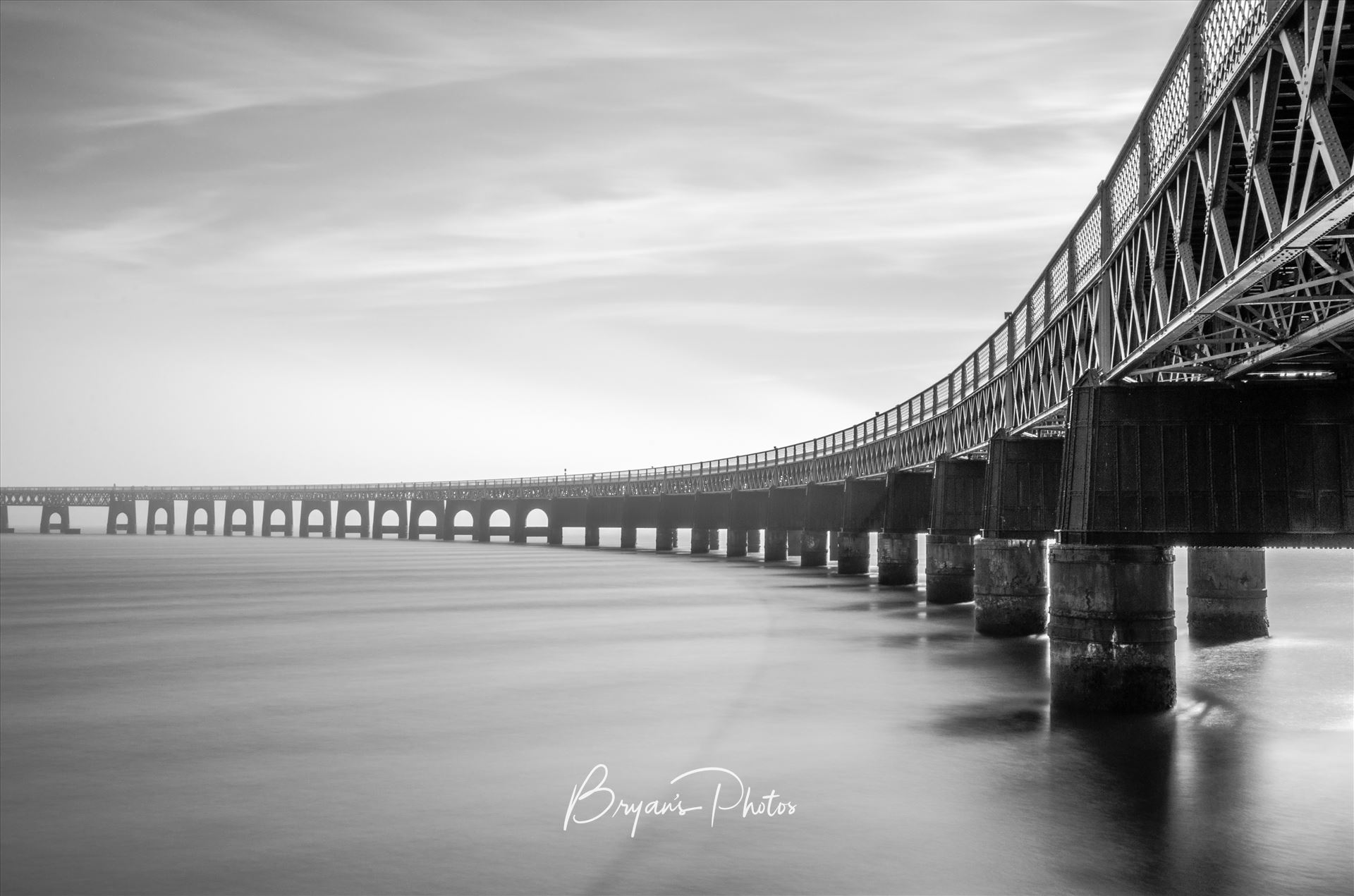 A Bridge to Fife - A black and white photograph of the Tay Rail Bridge looking towards Fife. by Bryans Photos