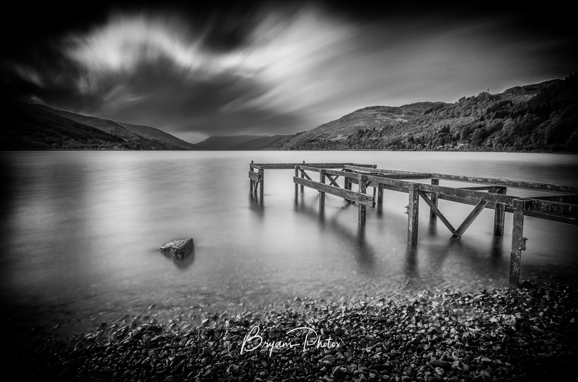 Loch Earn at St Fillans - A black and white long exposure photograph of Loch Earn taken from St Fillans. by Bryans Photos