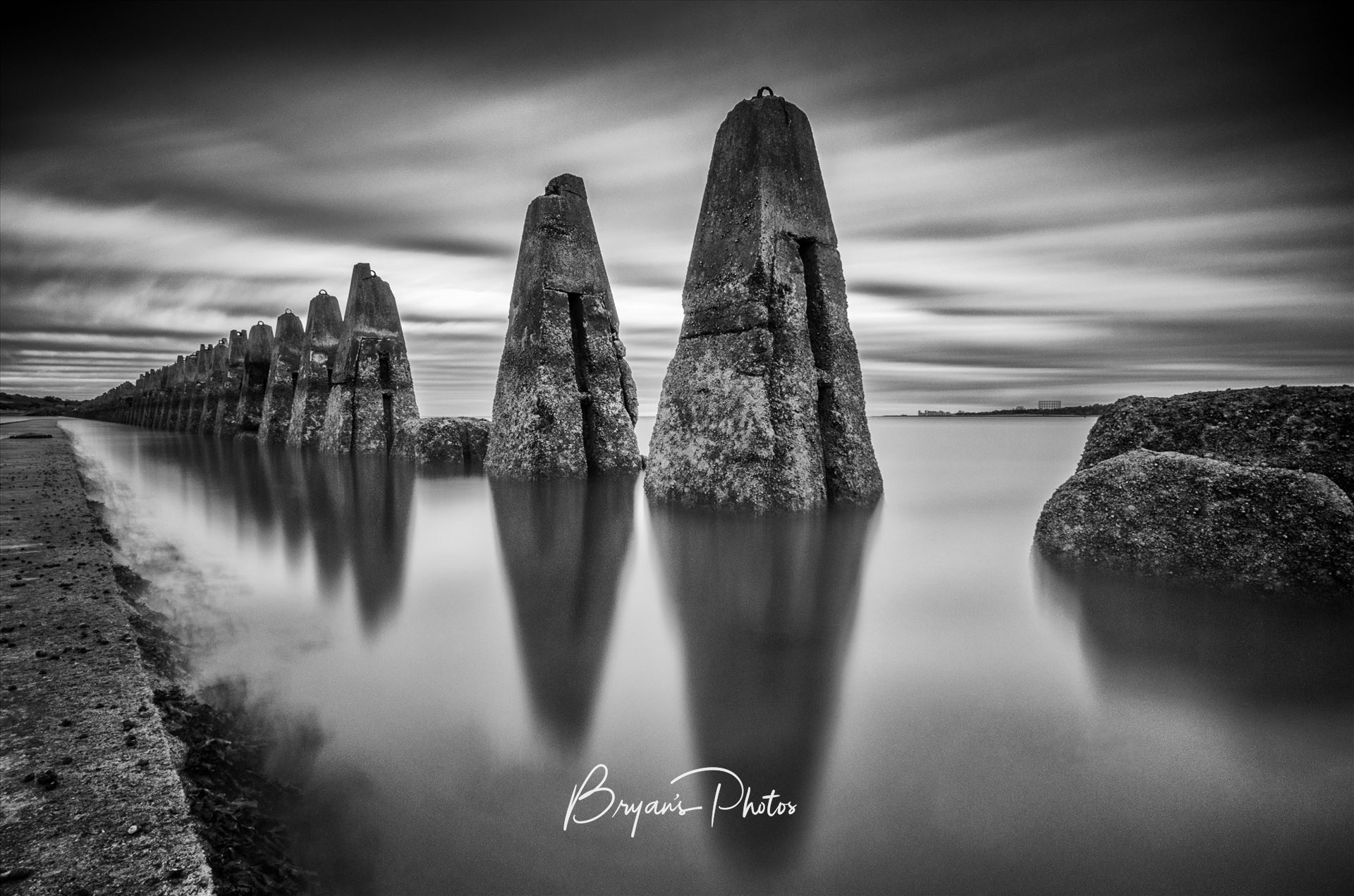 The Causeway - A black & white daytime long exposure photograph of the causeway to Cramond Island in the Firth of Forth. by Bryans Photos