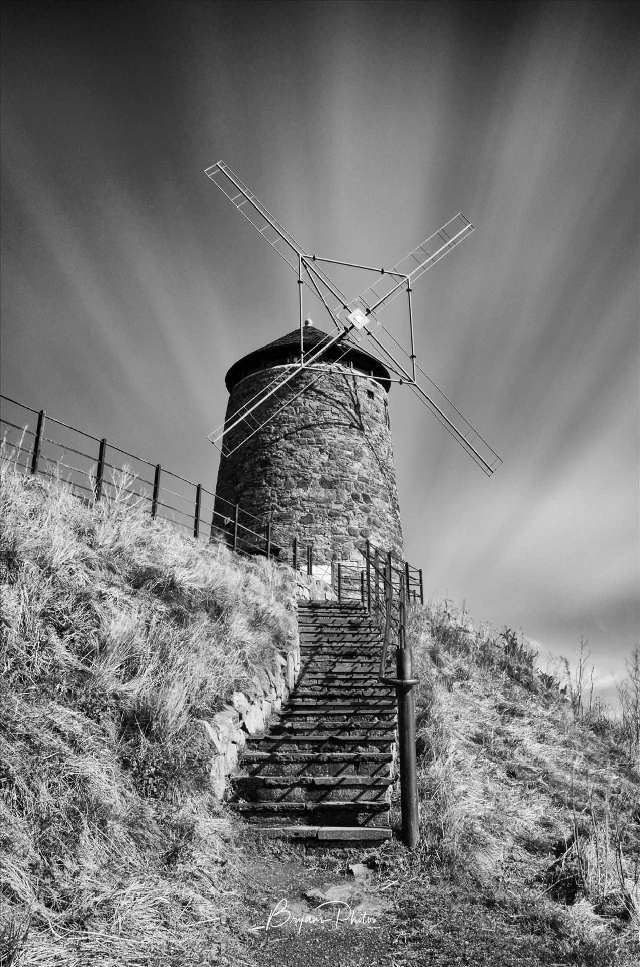 St Monans Windmill - A black and white long exposure photograph of the windmill at St Monans on the Fife coast. by Bryans Photos