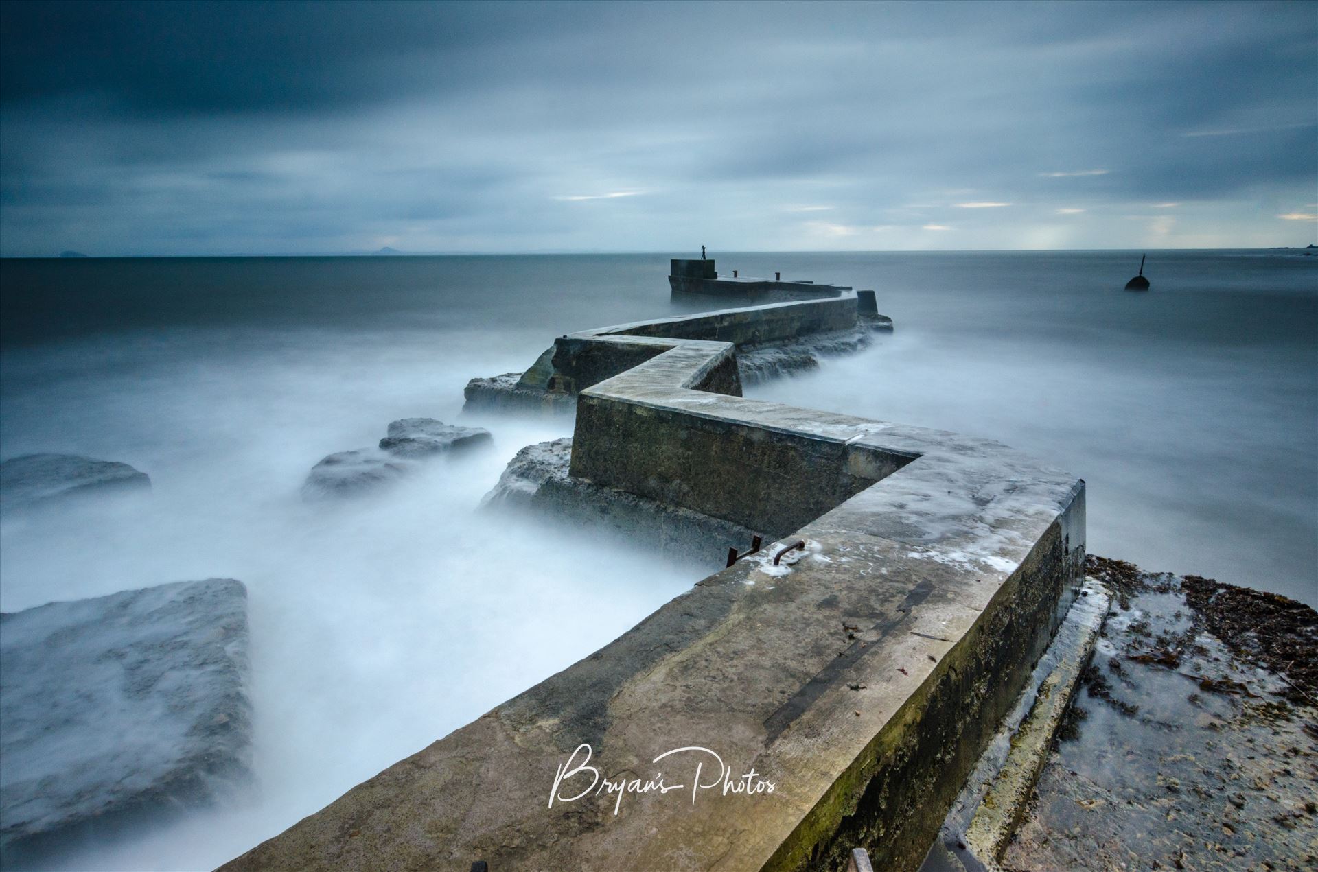 St Monans - A long exposure photo of the breakwater at St Monans on the Fife coast of Scotland by Bryans Photos