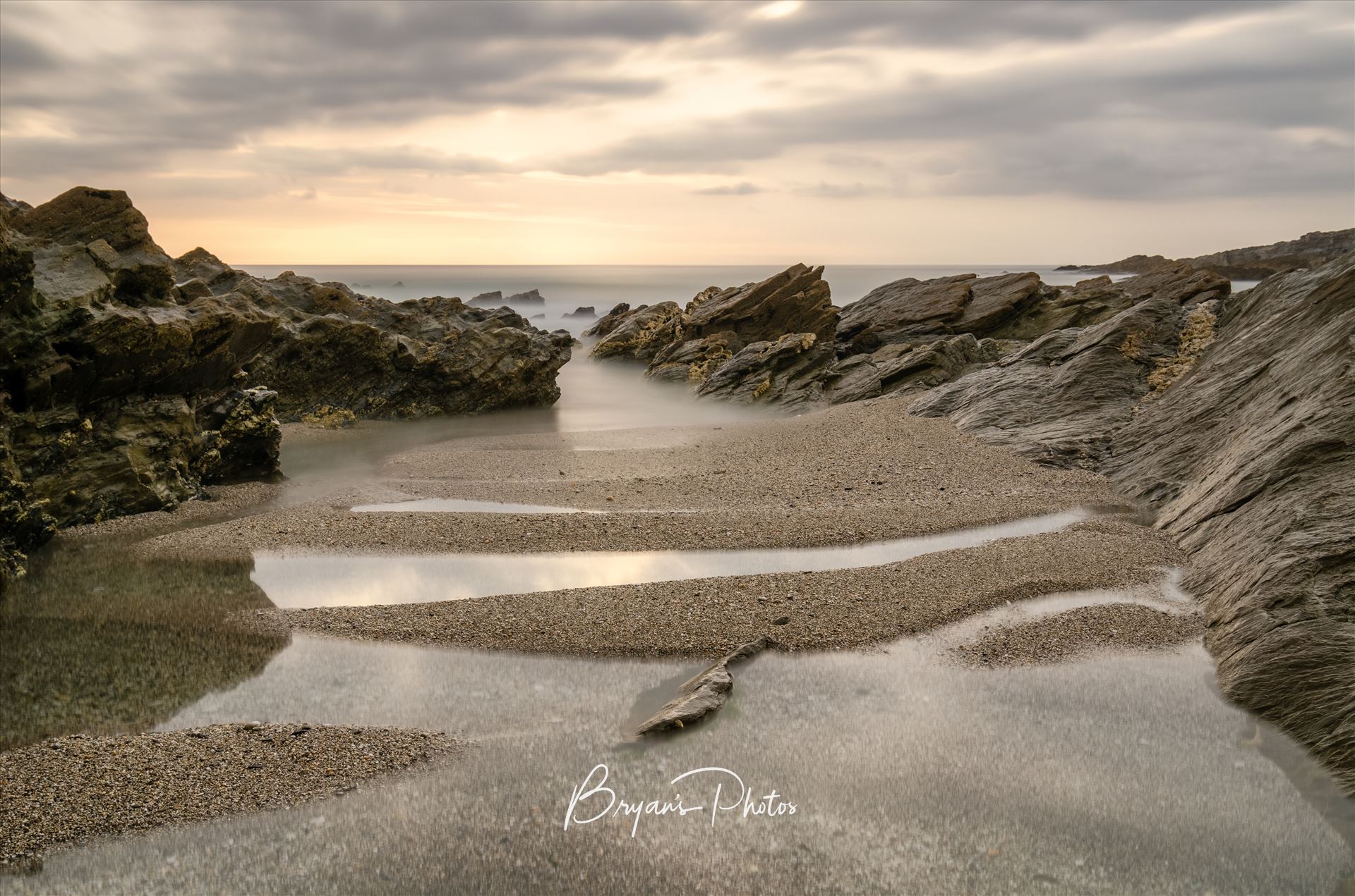 Little Fistral - A photograph of Little Fistral beach Newquay taken at low tide just before sunset. by Bryans Photos