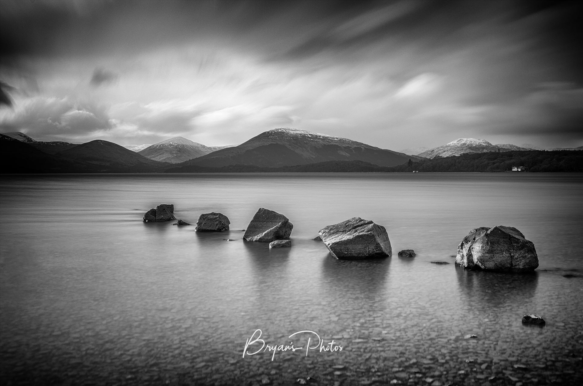 Milarrochy Rocks Landscape - A black and white long exposure photograph of Loch Lomond taken from Milarrochy Bay. by Bryans Photos