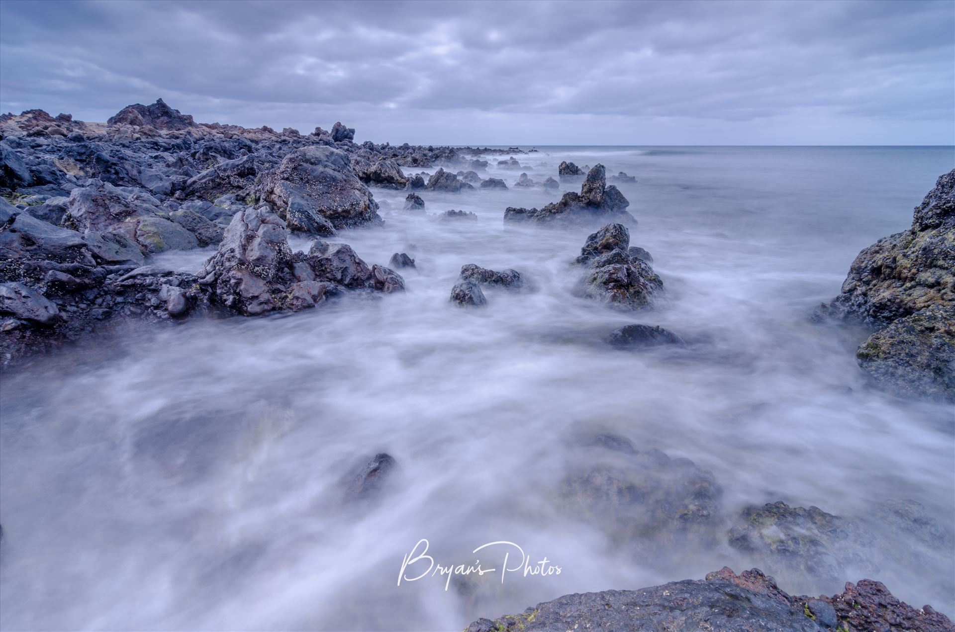 Lanzarote Seascape - A photograph taken from the beach at Los Piccolos Lanzarote looking out over the Atlantic Ocean. by Bryans Photos