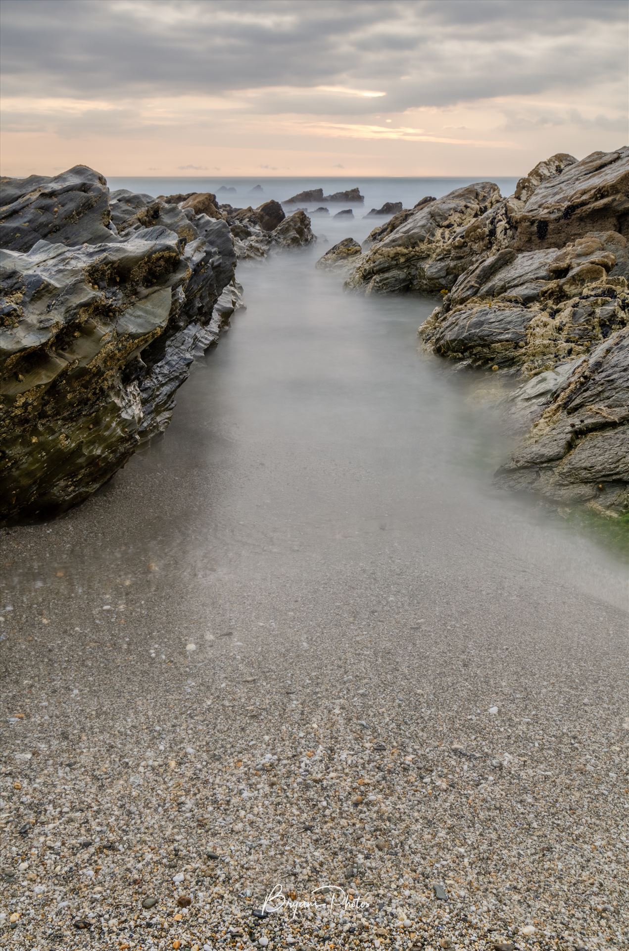 Little Fistal Portrait - A long exposure photograph of Little Fistral Beach Newquay taken as the tide goes out. by Bryans Photos