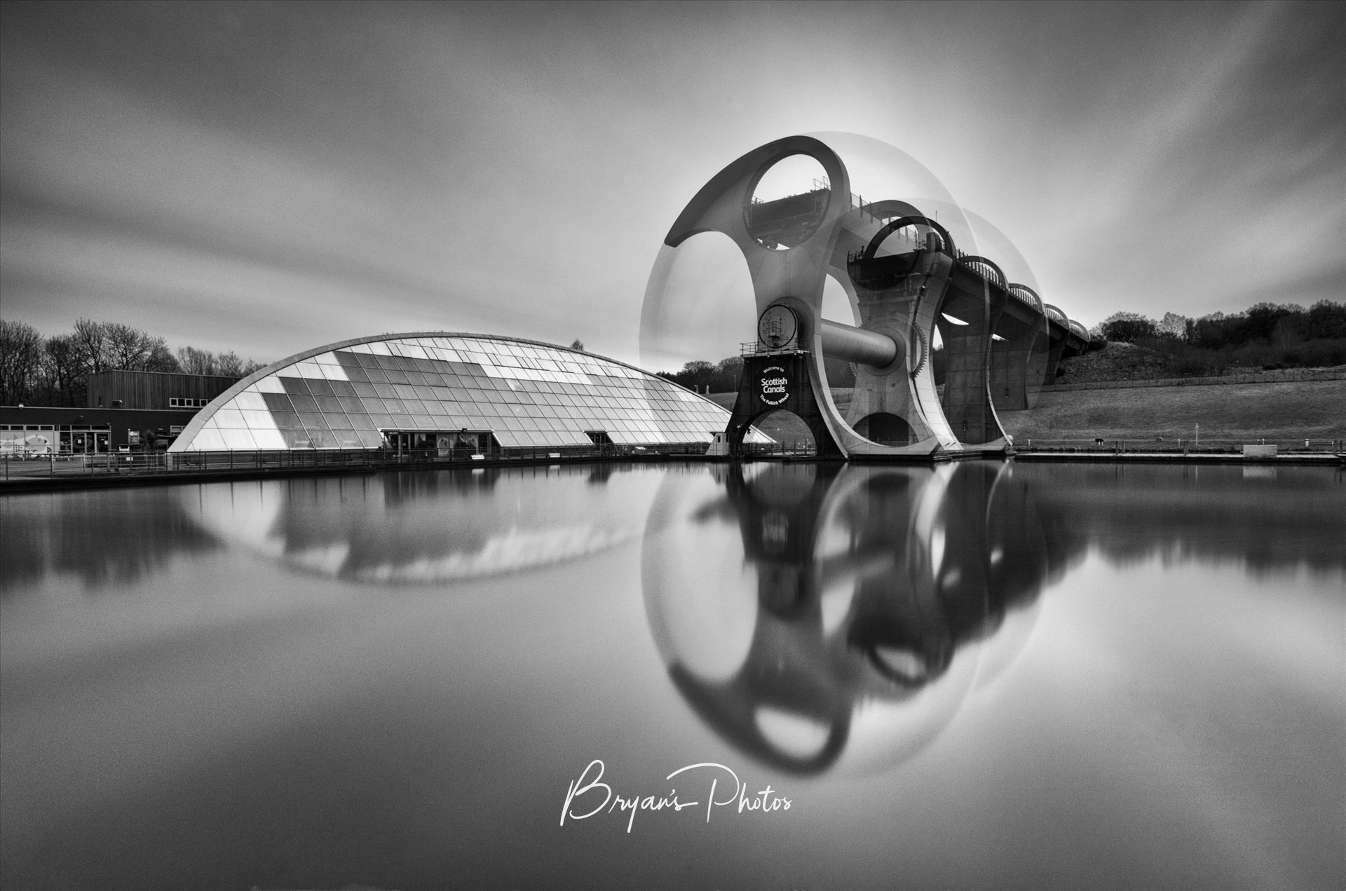 The Wheel - A black and white long exposure photograph of the famous Falkirk wheel in motion. by Bryans Photos