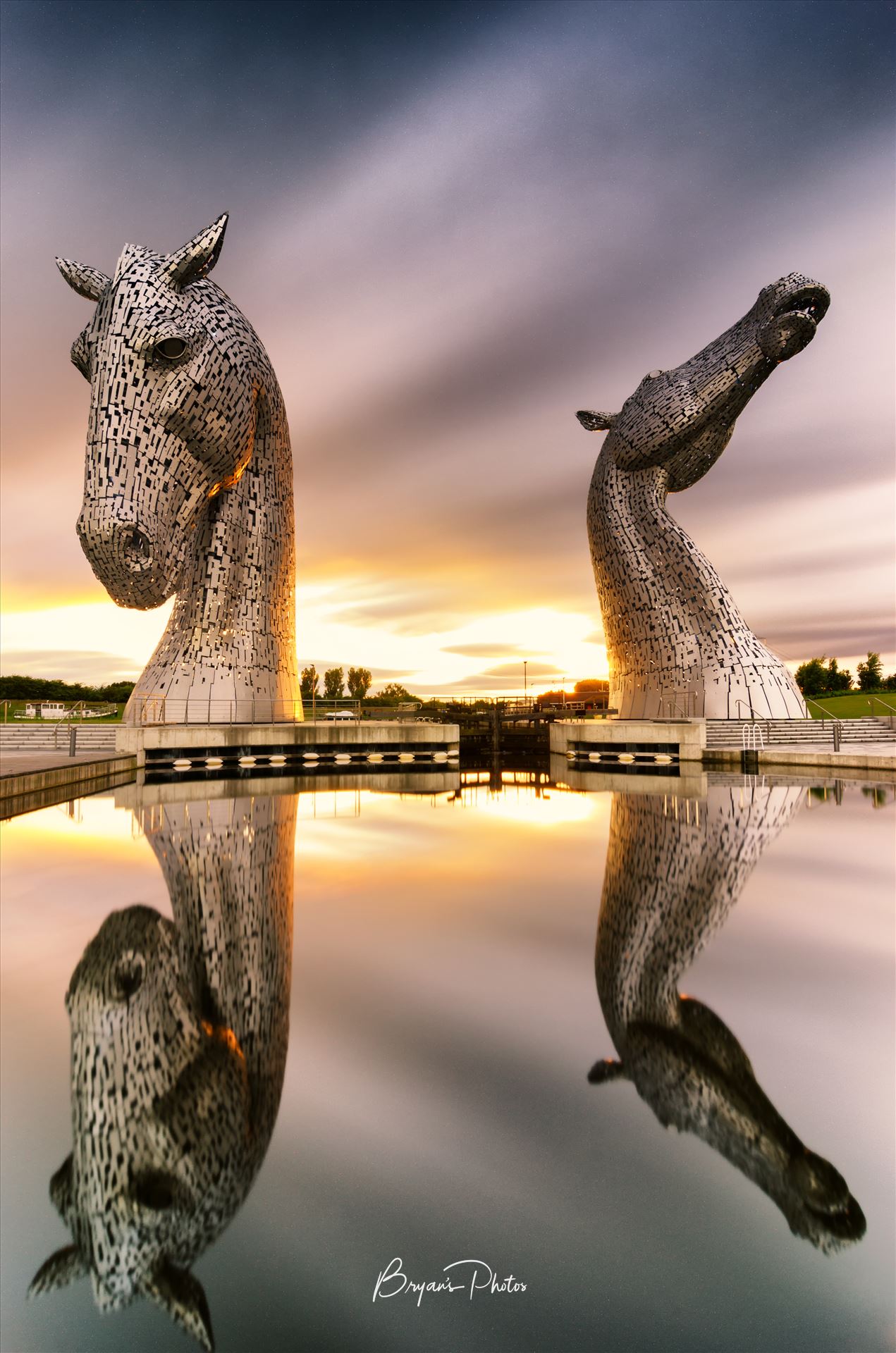 Kelpies Sunset - A long exposure photograph of the Kelpies taken at sunset. by Bryans Photos