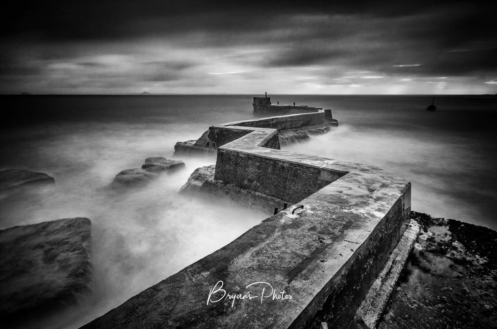 St Monans Breakwater - A black and white Photograph of the breakwater at St Monans on the Fife coast. by Bryans Photos