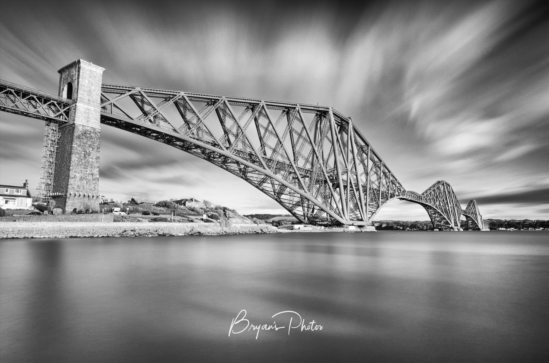 The Bridge - A black and white long exposure photograph of the iconic Forth Rail Bridge taken from North Queensferry. by Bryans Photos