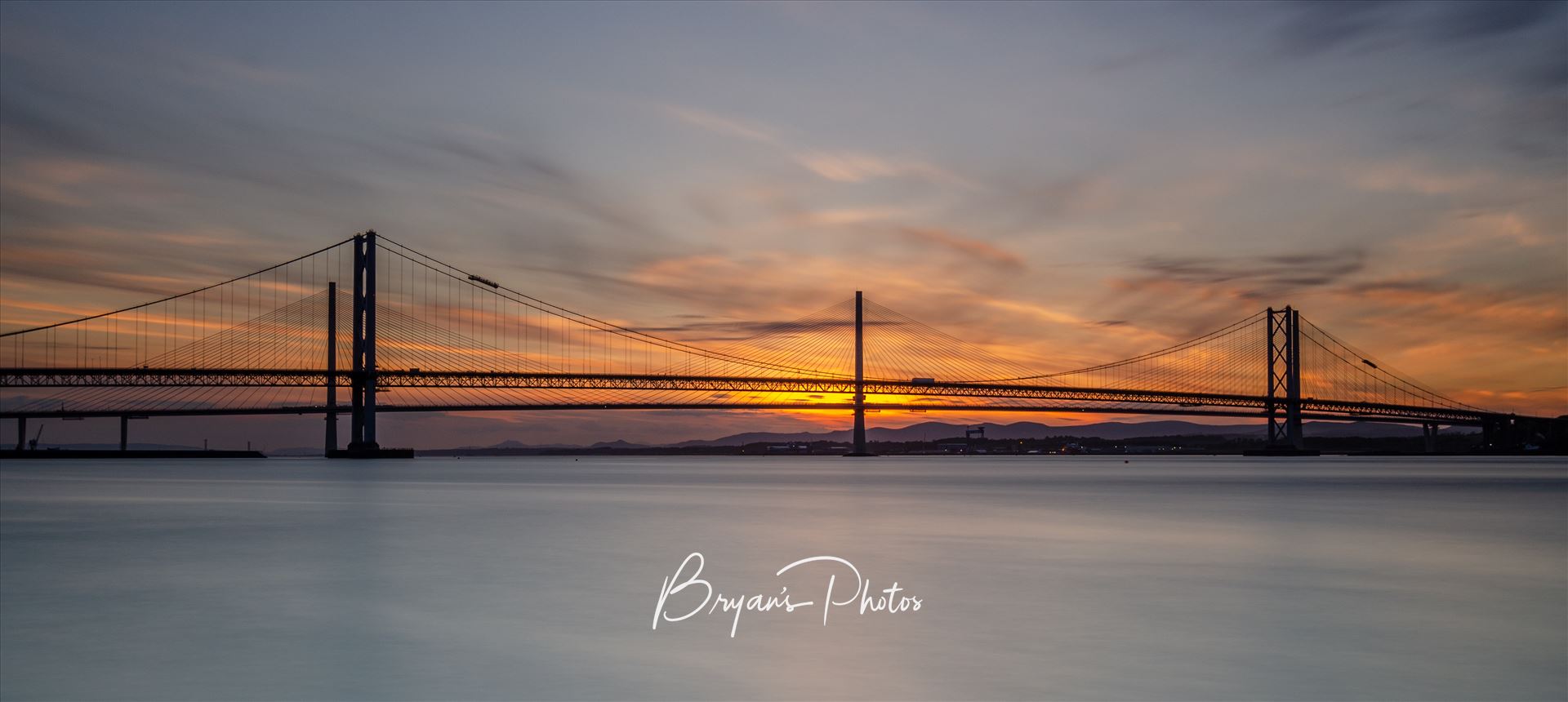 Road Bridges at Sunset - A photograph of the Forth Road Bridge and Queensferry crossing taken at sunset from Hawes Pier South Queensferry. by Bryans Photos