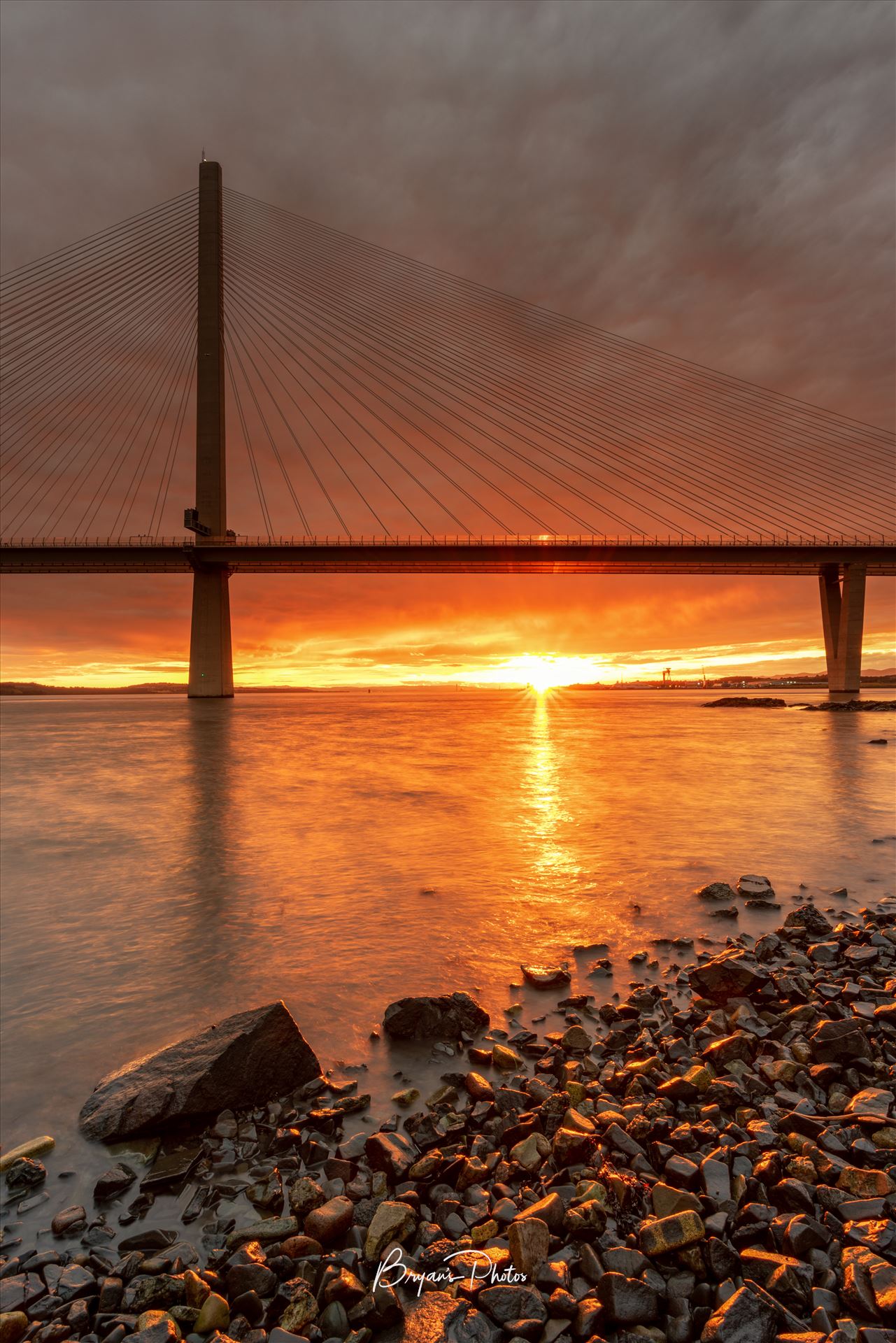 The Crossing at Sunset - A photograph of the Queensferry crossing taken at sunset from North Queensferry. by Bryans Photos