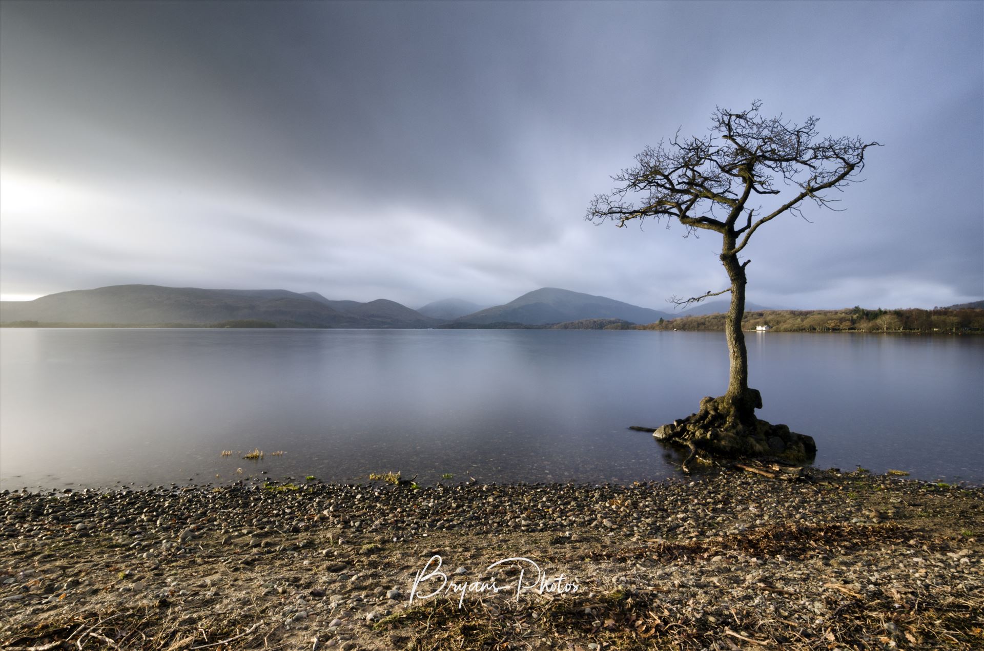 Milarrochy Bay - A colour photograph of Loch Lomond taken from Milarrochy Bay on the eastern shore of the loch near Balmaha. by Bryans Photos