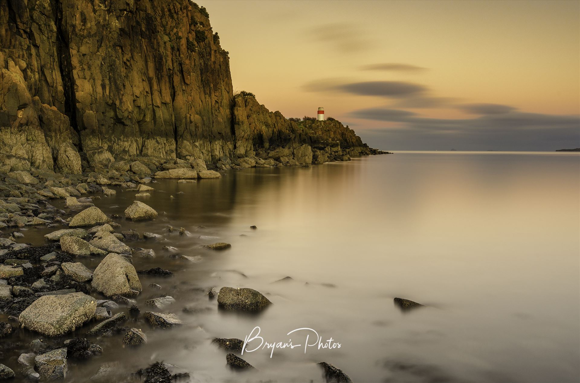 Hawkcraig Point - A colour long exposure photograph taken at sunset of Hawkcraig point Aberdour. by Bryans Photos