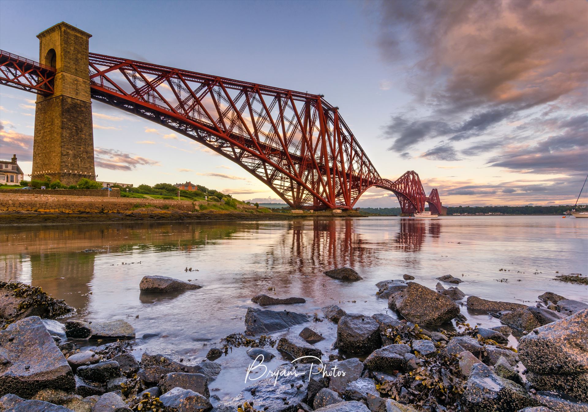 The Bridge - A colour photograph of the Forth Rail Bridge taken from North Queensferry at sunet. by Bryans Photos