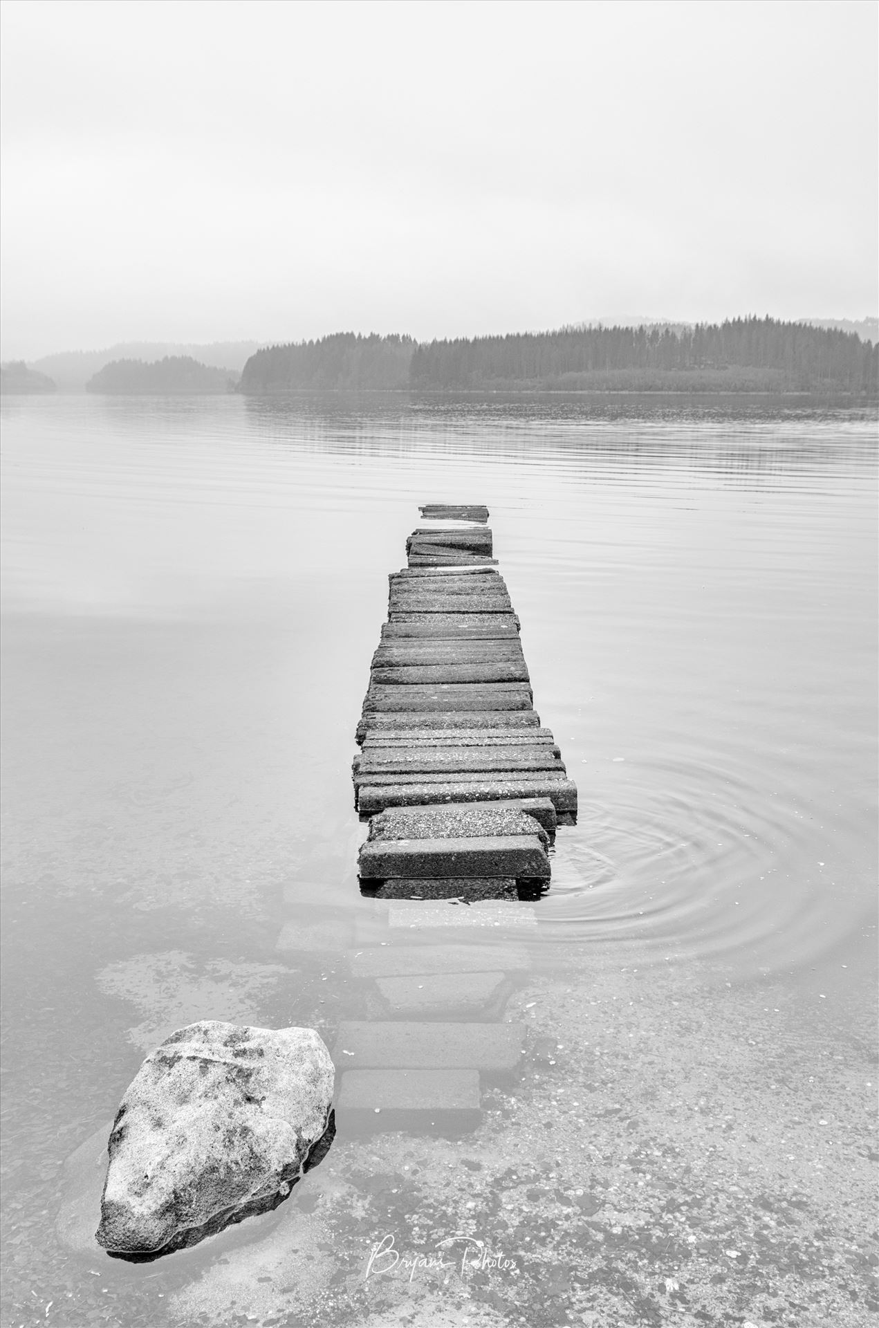 Loch Ard Jetty - A black and white photograph of the jetty at Loch Ard. by Bryans Photos