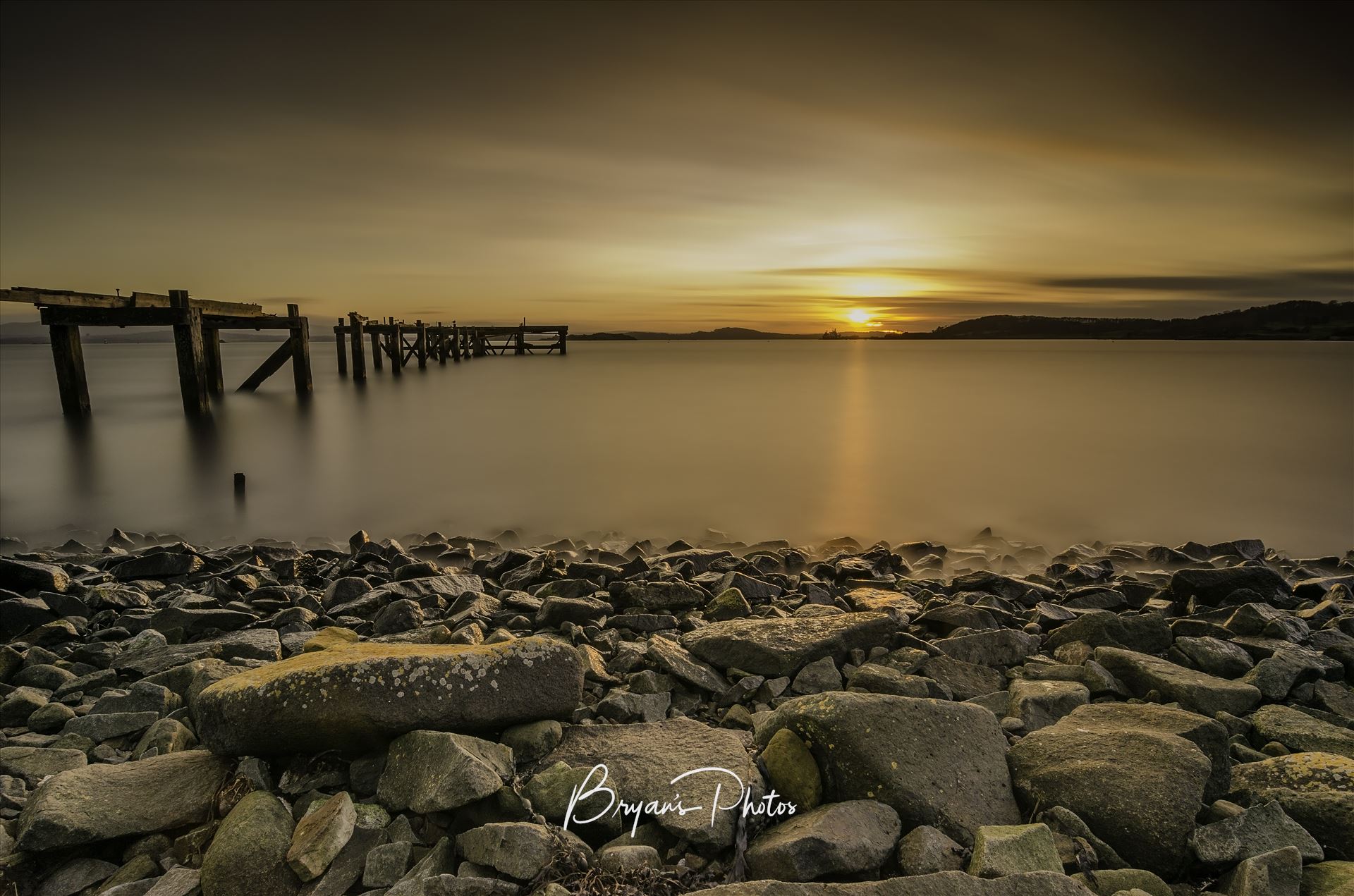 Sunset at Hawkcraig - A long exposure photograph of the abandoned  Hawkcraig pier at Aberdour taken at sunset. by Bryans Photos