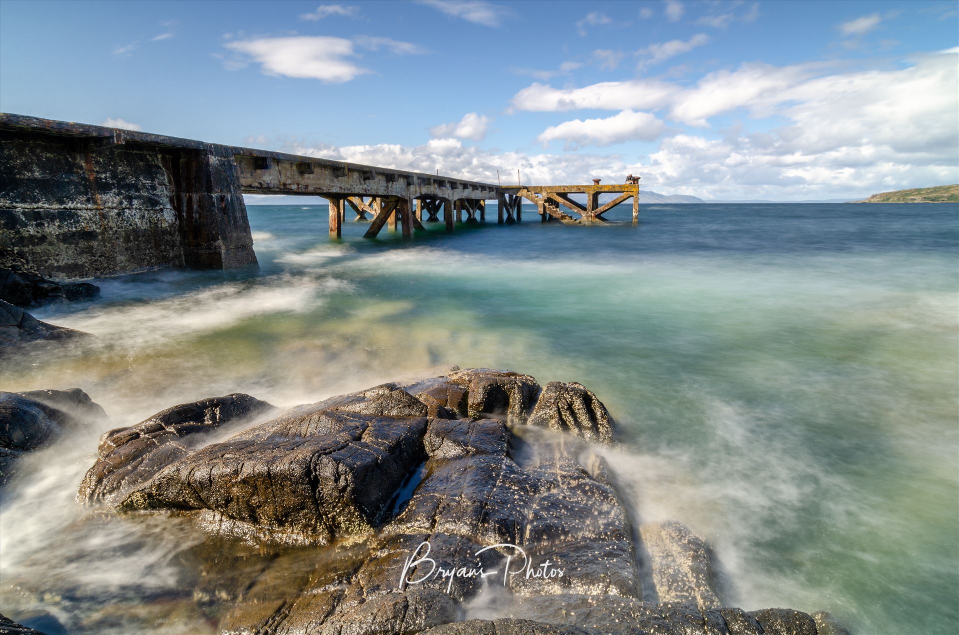 Portencross Pier Landscape - A photograph of the pier at Portenross looking over towards the Isle of Arran. by Bryans Photos