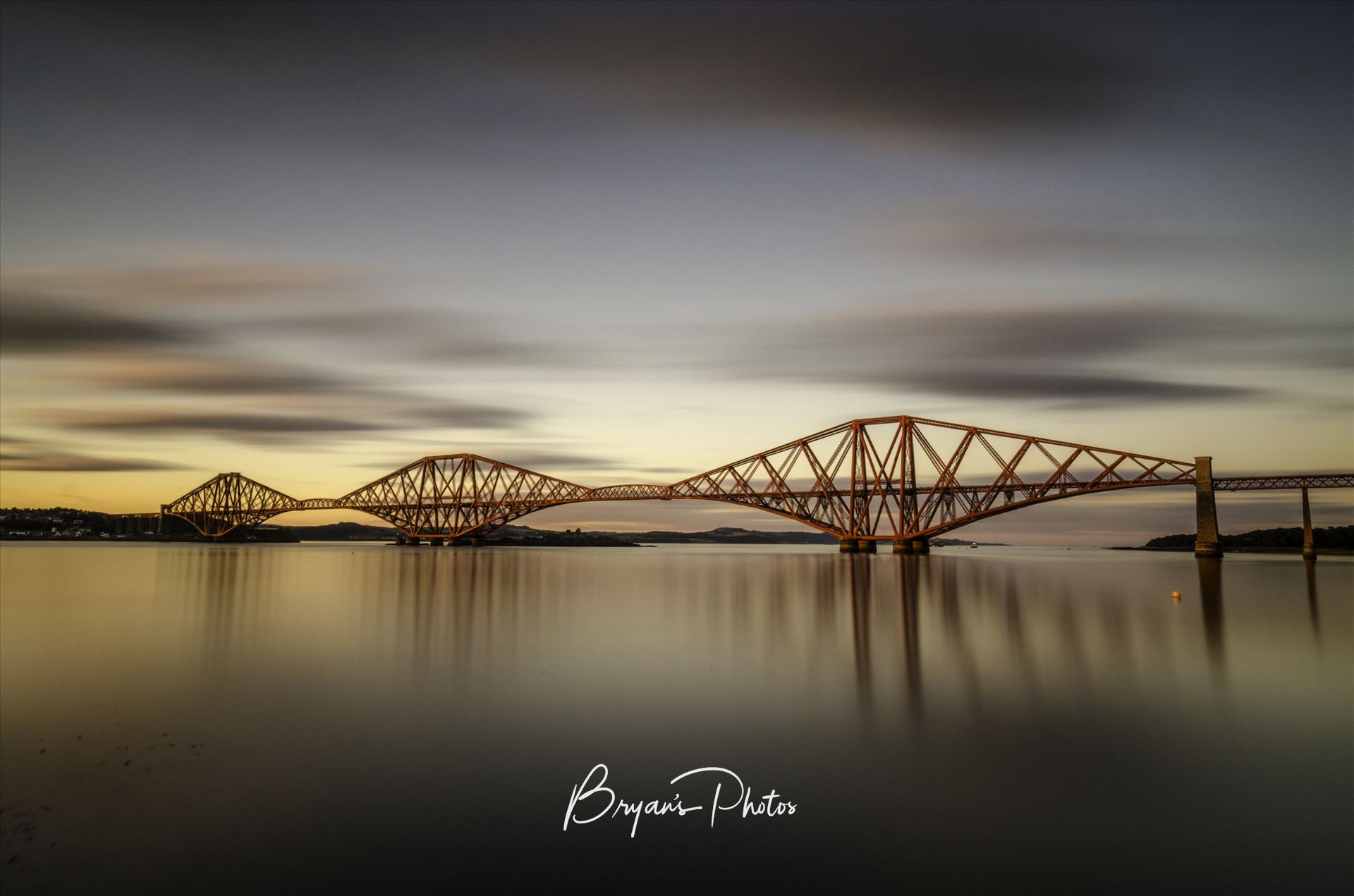 The Bridge at Sunset - A long exposure photograph of the Forth Rail Bridge taken at sunset from South Queensferry. by Bryans Photos