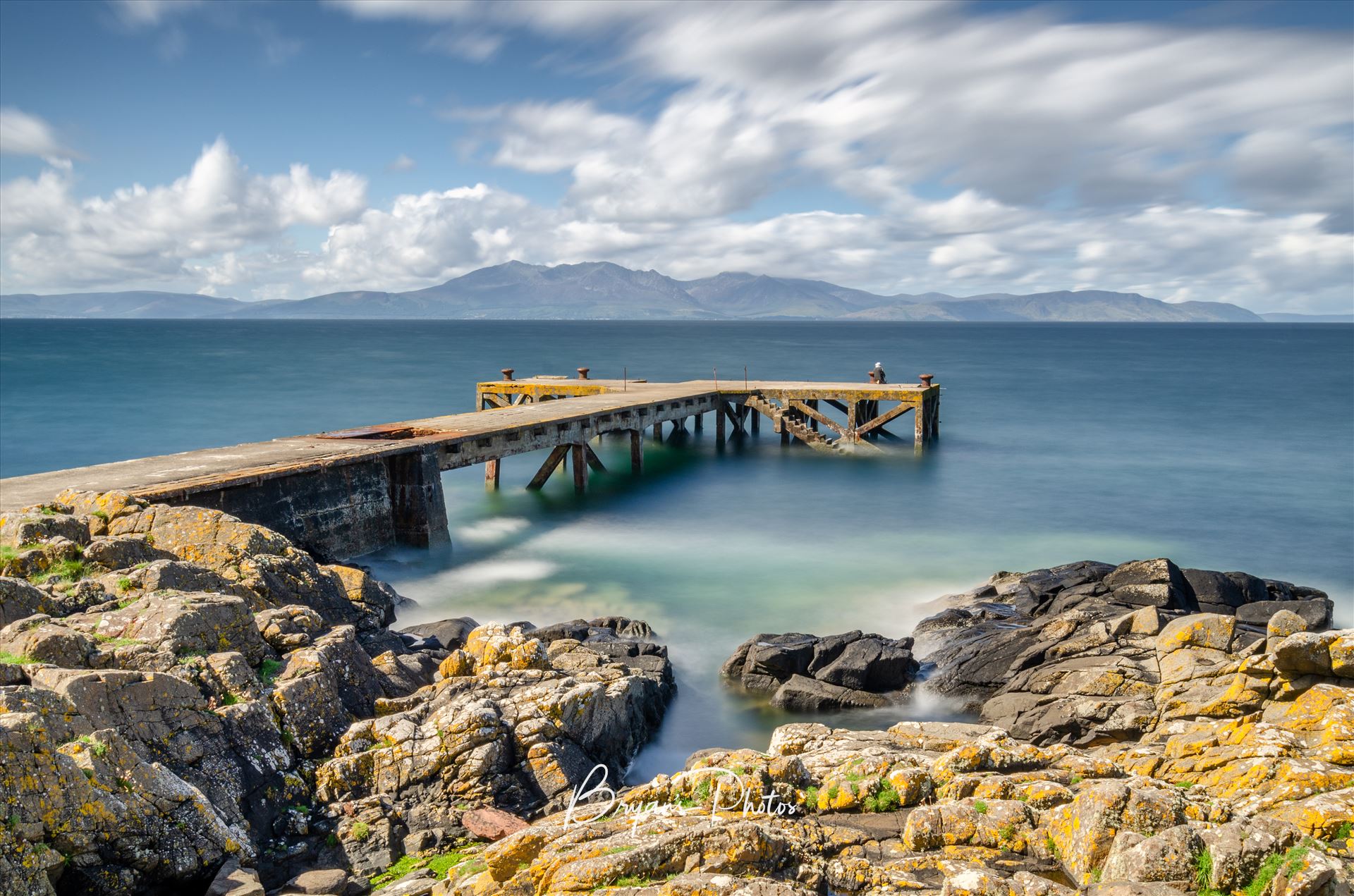 Portencross - A photograph of the pier at Portenross looking over towards the Isle of Arran. by Bryans Photos