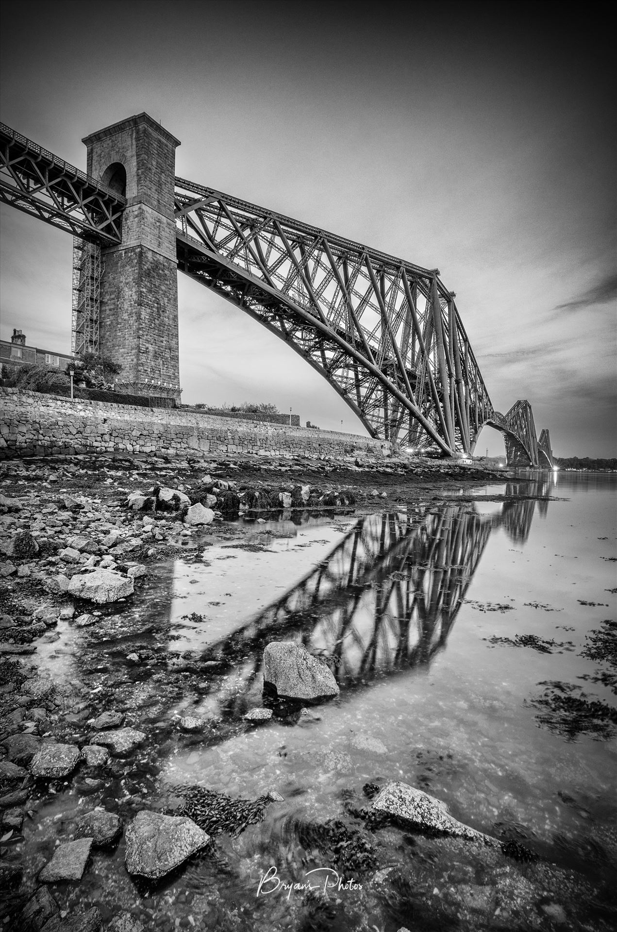 Rail Bridge Portrait - A black and white portrait photograph of the Forth Rail Bridge taken from North Queensferry. by Bryans Photos