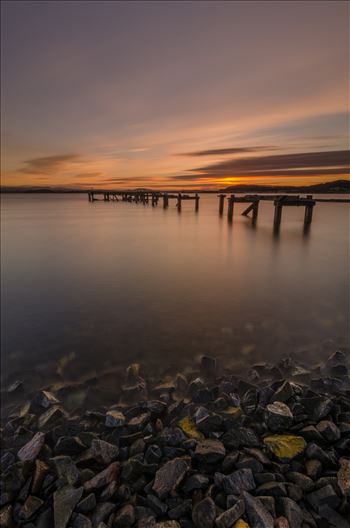 A photograph of the Abandoned pier at Aberdour on the Fife coast taken as the sun sets.