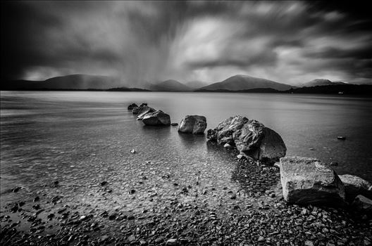 A black and white long exposure photograph of Loch Lomond taken from Milarrochy Bay.