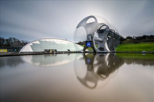 A long exposure photograph of the Falkirk Wheel capturing the movement of the wheel as it lifts boats between the Forth and Clyde and Union canals.