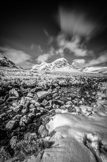 A black and white long exposure photograph of Glen Etive in the Scottish Highlands.