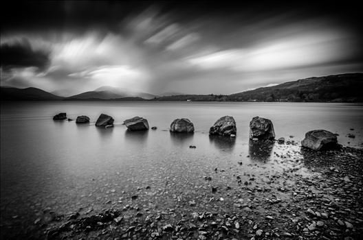 A black and white long exposure photograph of Loch Lomond taken from Milarrochy Bay.