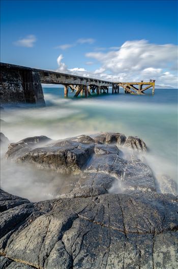 A photograph of the pier at Portenross looking over towards the Isle of Arran.