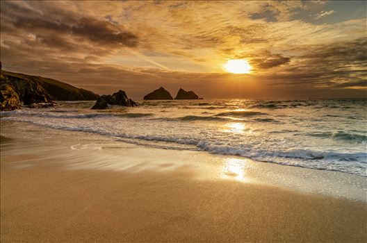 A photograph of Holywell Bay Cornwall taken as the sun sets on a summer evening