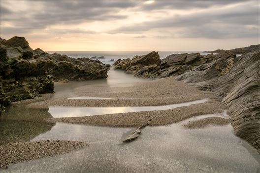 A photograph of Little Fistral beach Newquay taken at low tide just before sunset.