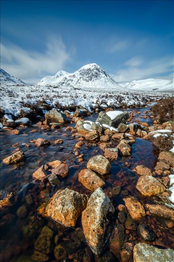 A long exposure photograph of Glen Etive in the Scottish Highlands.