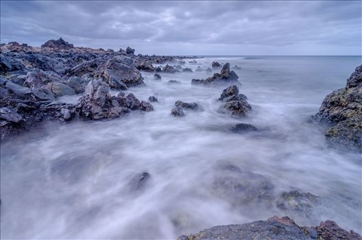 A photograph taken from the beach at Los Piccolos Lanzarote looking out over the Atlantic Ocean.