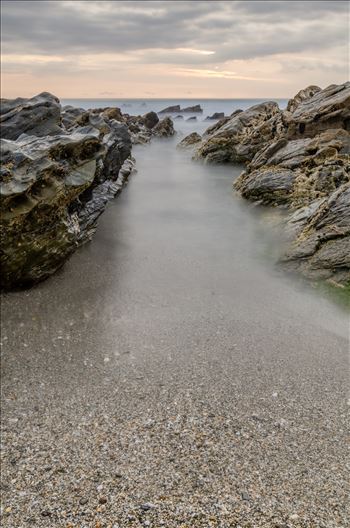 A long exposure photograph of Little Fistral Beach Newquay taken as the tide goes out.