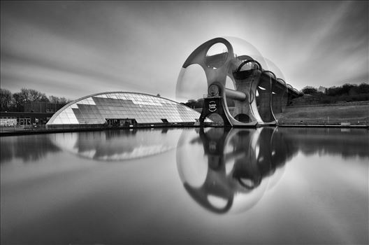 A black and white long exposure photograph of the famous Falkirk wheel in motion.