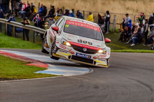 A photograph of Jason Plato getting his Astra on two wheels during qualifying for the 2019 touring cars race at Knockhill racing circuit. (photograph taken from public access area)