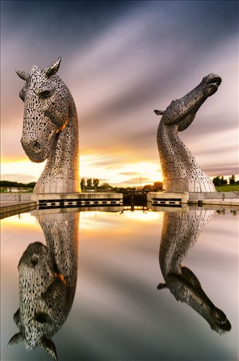 A long exposure photograph of the Kelpies taken at sunset.